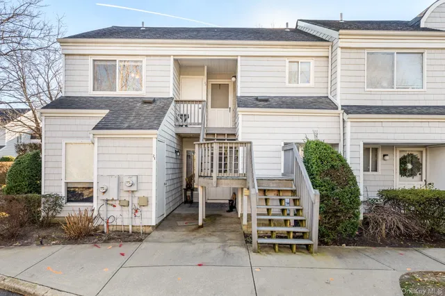 a front view of a house with a porch