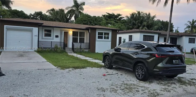 a car parked in front of a house