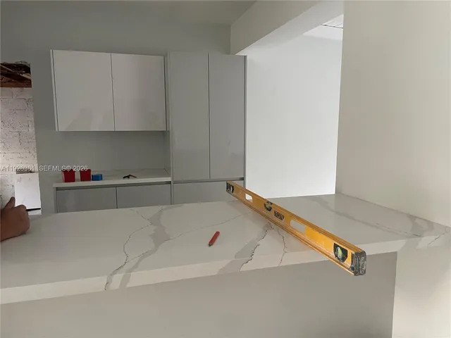 a bath tub sitting in a white cabinet