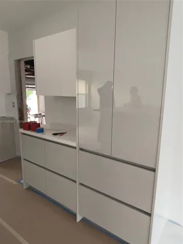 a bathroom with a shower and a sink