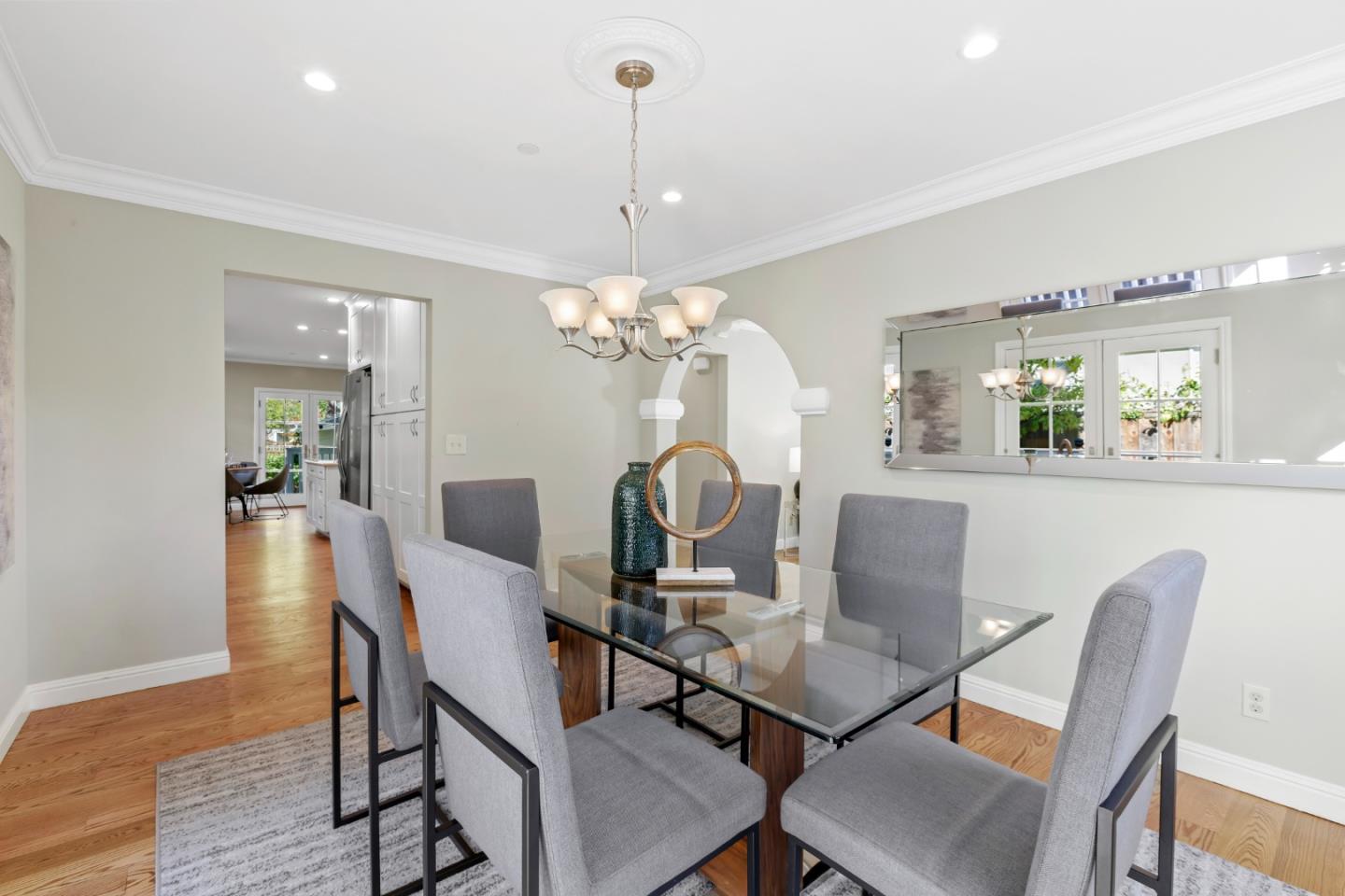 1001 Harvard Road San Mateo, CA 94402 - Photo 15 of 54 a view of a dining room with furniture and wooden floor