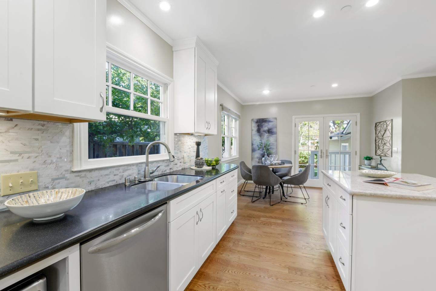1001 Harvard Road San Mateo, CA 94402 - Photo 17 of 54 a large kitchen with kitchen island a sink and a large window