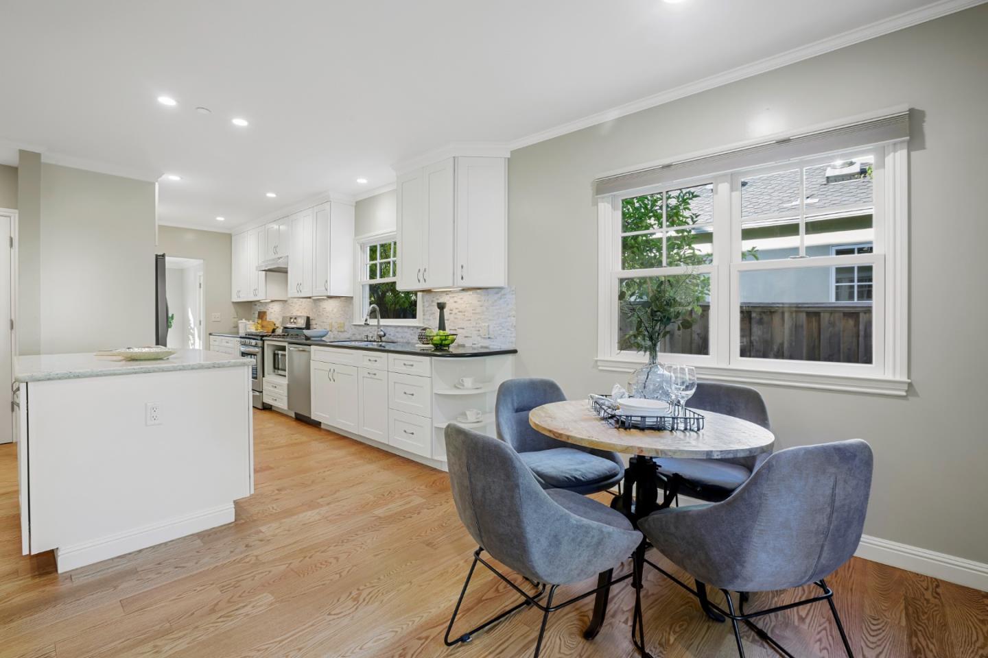 1001 Harvard Road San Mateo, CA 94402 - Photo 22 of 54 a kitchen with a dining table chairs and window