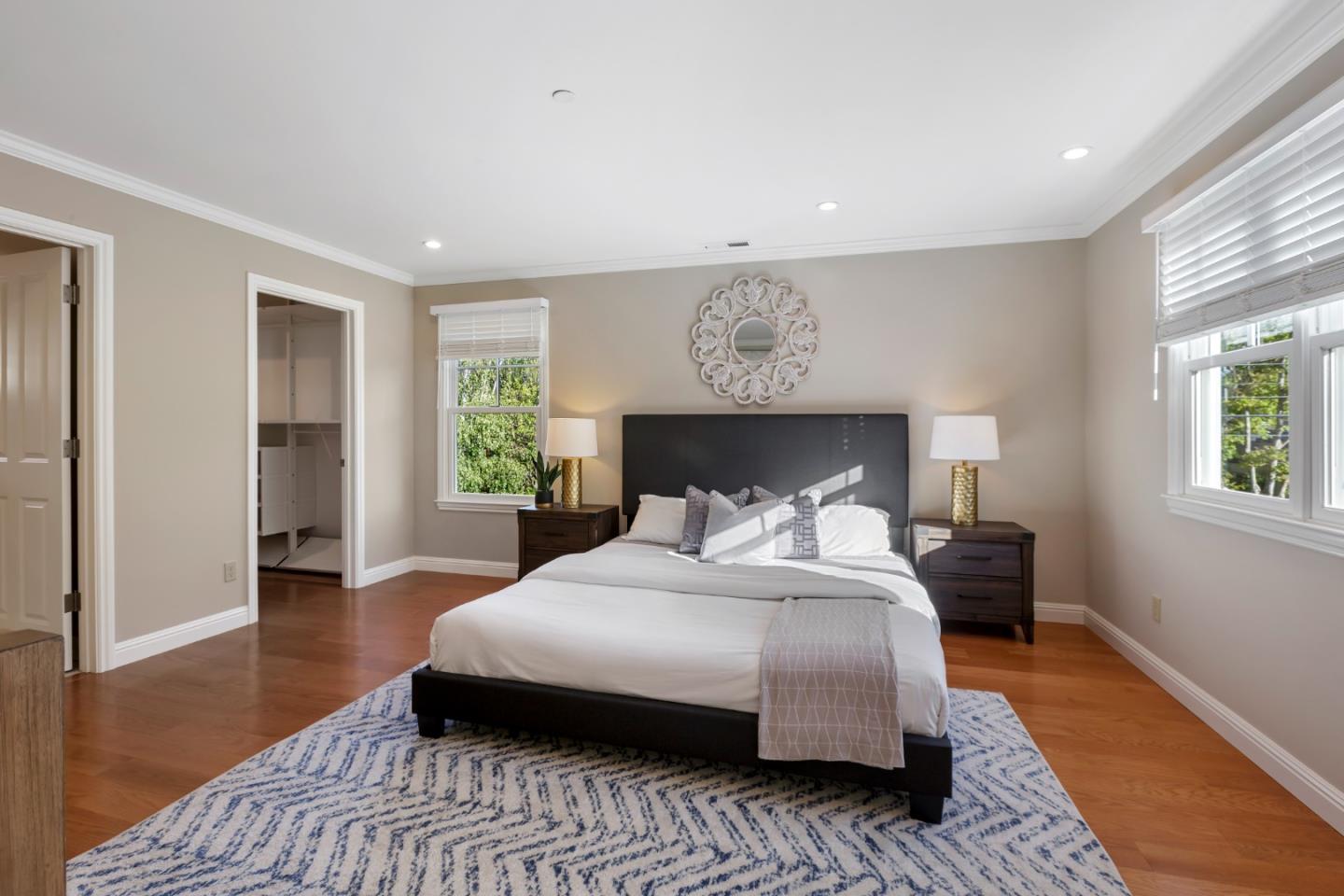 1001 Harvard Road San Mateo, CA 94402 - Photo 25 of 54 a bedroom with a large bed and a window