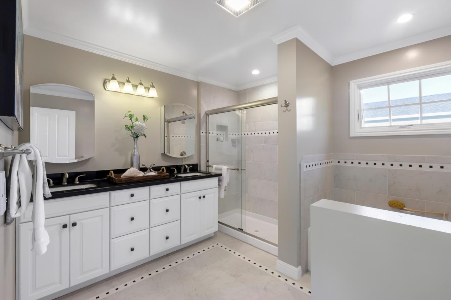 1001 Harvard Road San Mateo, CA 94402 - Photo 27 of 54 a bathroom with double sink and a mirror