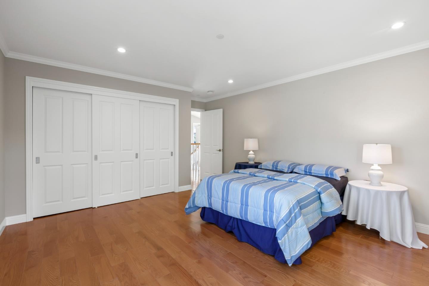 1001 Harvard Road San Mateo, CA 94402 - Photo 34 of 54 a bedroom with a bed and a lamp