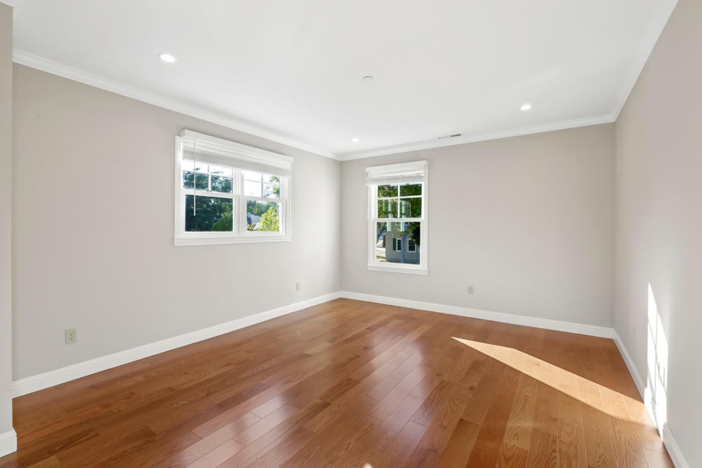 1001 Harvard Road San Mateo, CA 94402 - Photo 36 of 54 an empty room with wooden floor and windows