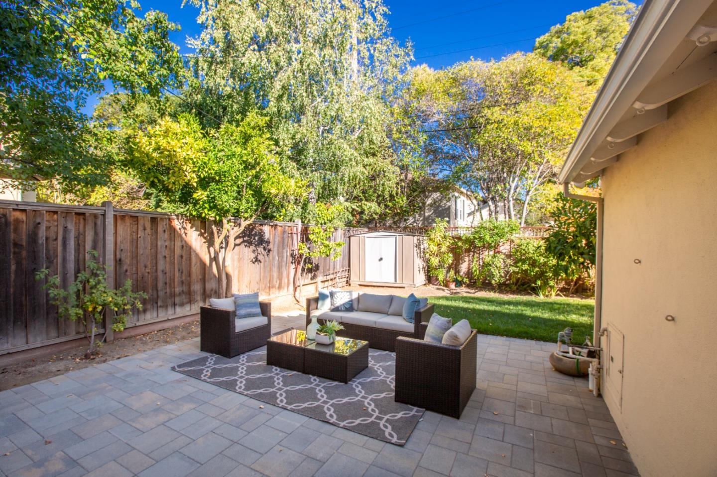 1001 Harvard Road San Mateo, CA 94402 - Photo 41 of 54 a backyard of a house with table and chairs