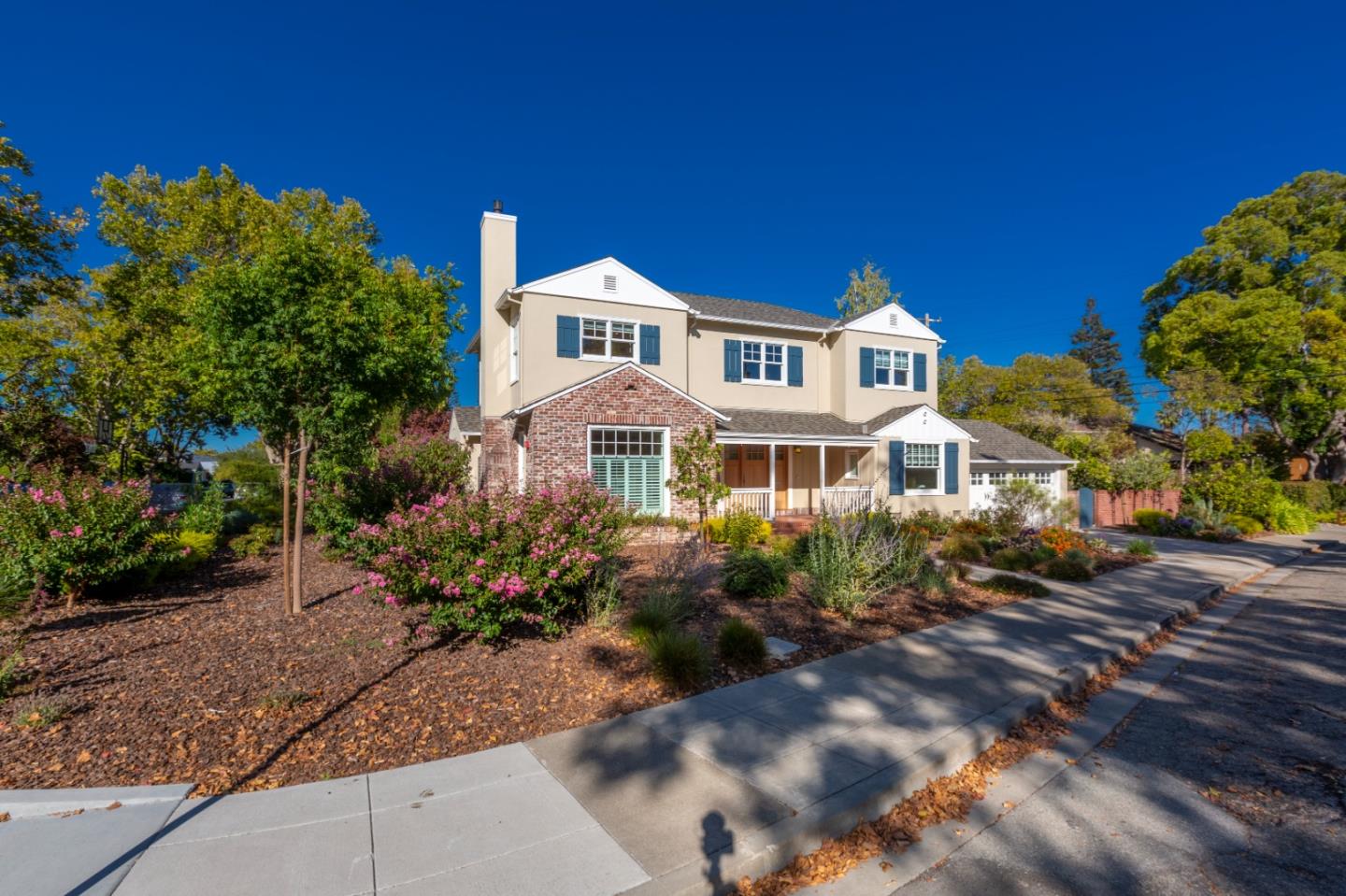 1001 Harvard Road San Mateo, CA 94402 - Photo 5 of 54 a front view of a house with a yard