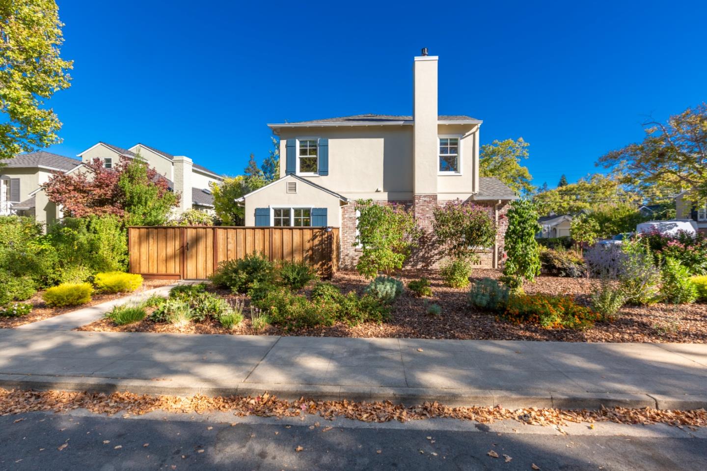 1001 Harvard Road San Mateo, CA 94402 - Photo 6 of 54 a front view of a house with a yard