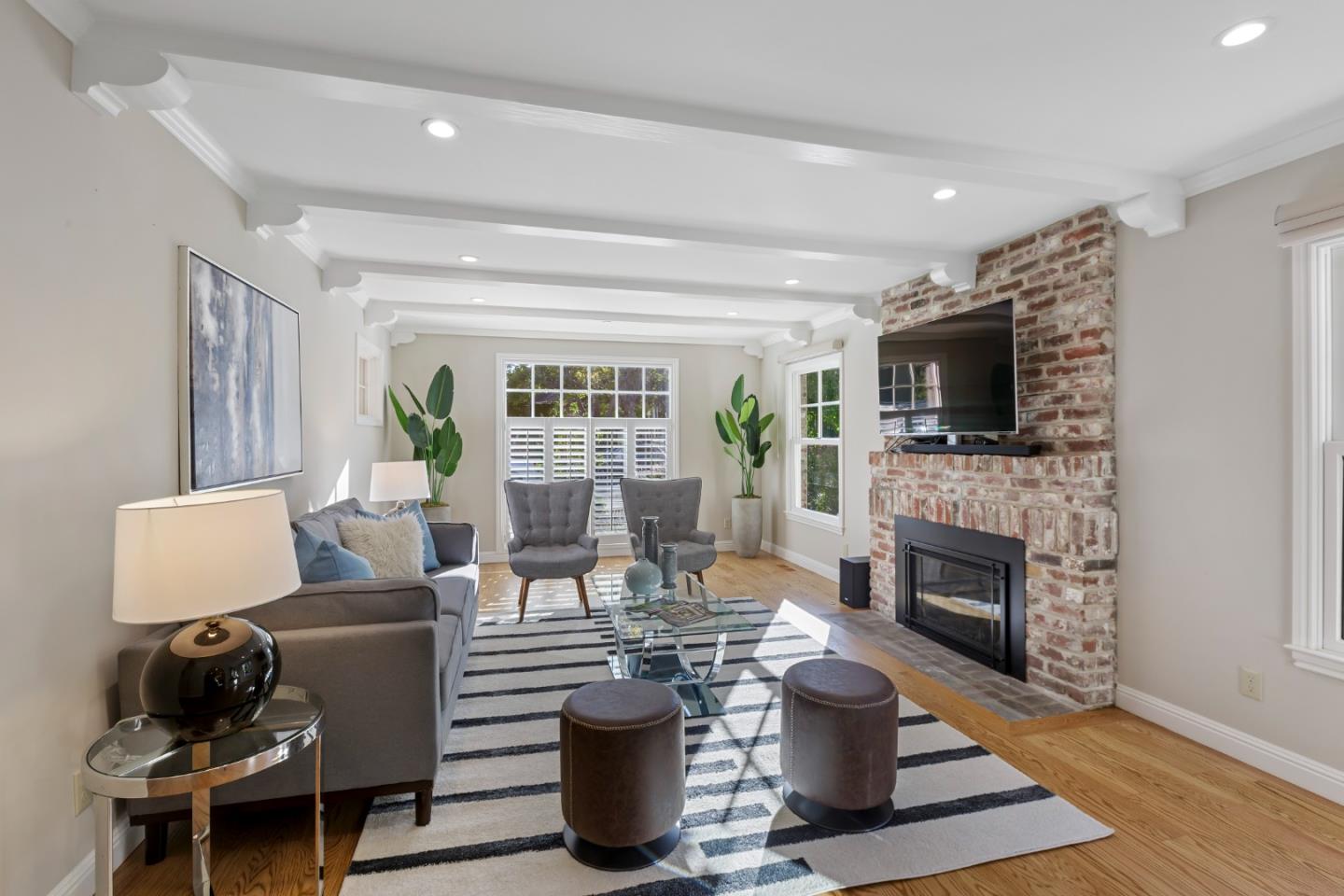 1001 Harvard Road San Mateo, CA 94402 - Photo 9 of 54 a living room with furniture a fireplace and a flat screen tv