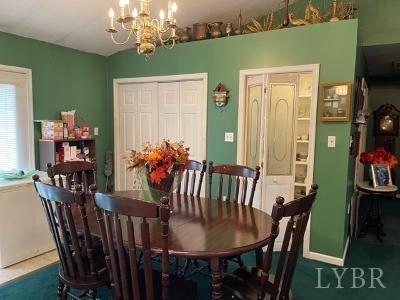 5185 Wards Road Evington, VA 24550 - Photo 13 of 26 a view of a dining room with furniture and chandelier