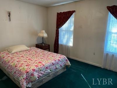 5185 Wards Road Evington, VA 24550 - Photo 19 of 26 a bedroom with a bed and window