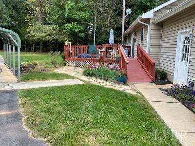 5185 Wards Road Evington, VA 24550 - Photo 7 of 26 a view of a chair and table in the garden