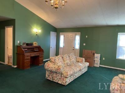 5185 Wards Road Evington, VA 24550 - Photo 10 of 26 a living room with furniture and a piano