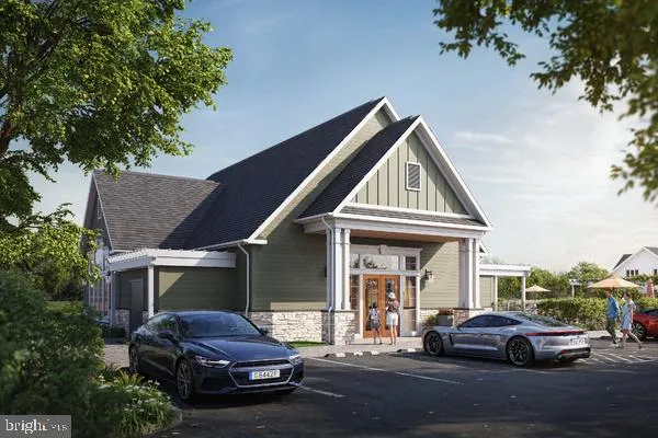 a front view of a house with car parked