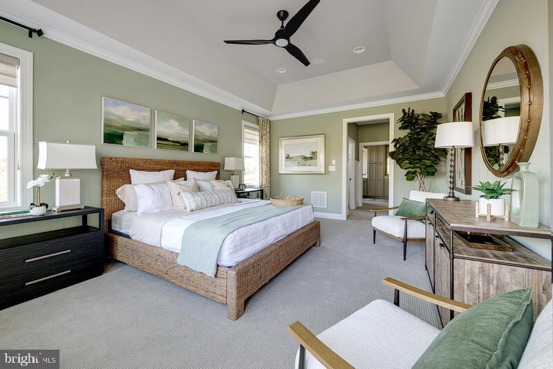 24591 Inkberry Drive Harbeson, DE 19951 - Photo 4 of 11 a spacious bedroom with a bed a table window and couch