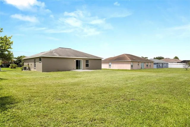 a city view with tall trees in the background