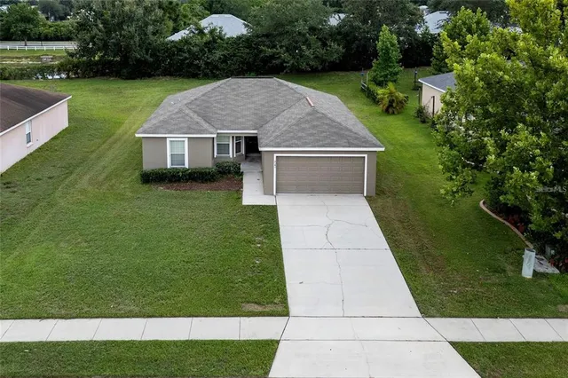 a aerial view of a house with garden