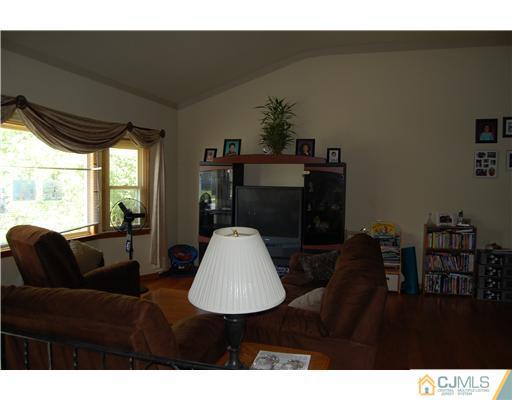 23 Barton Road Old Bridge, NJ 08857 - Photo 3 of 7 a living room with furniture and a window