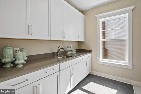 a kitchen with a sink and cabinets