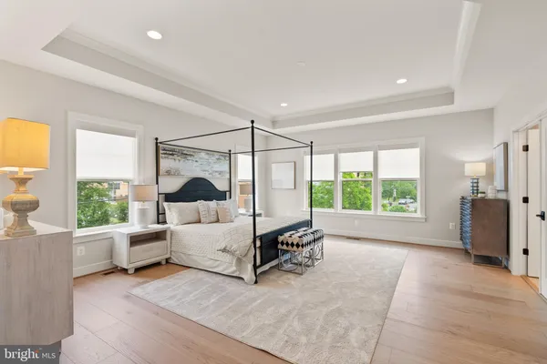 a living room with a large window bed and furniture