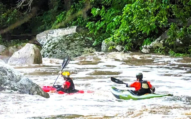a swimming pool with outdoor seating and yard