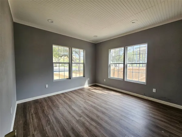 a kitchen with wooden floor
