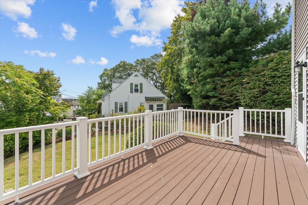 91 Prentice Street Waltham, MA 02451 - Photo 34 of 38 a view of deck with wooden floor and fence