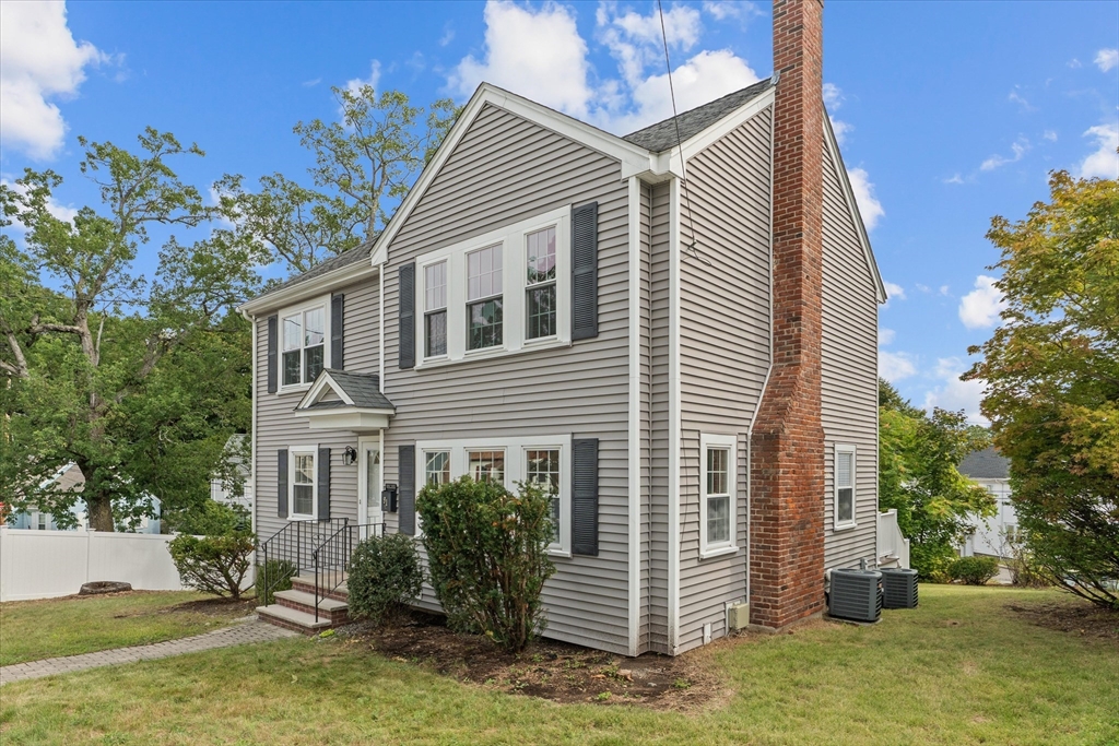 91 Prentice Street Waltham, MA 02451 - Photo 35 of 38 a front view of house with yard and trees around