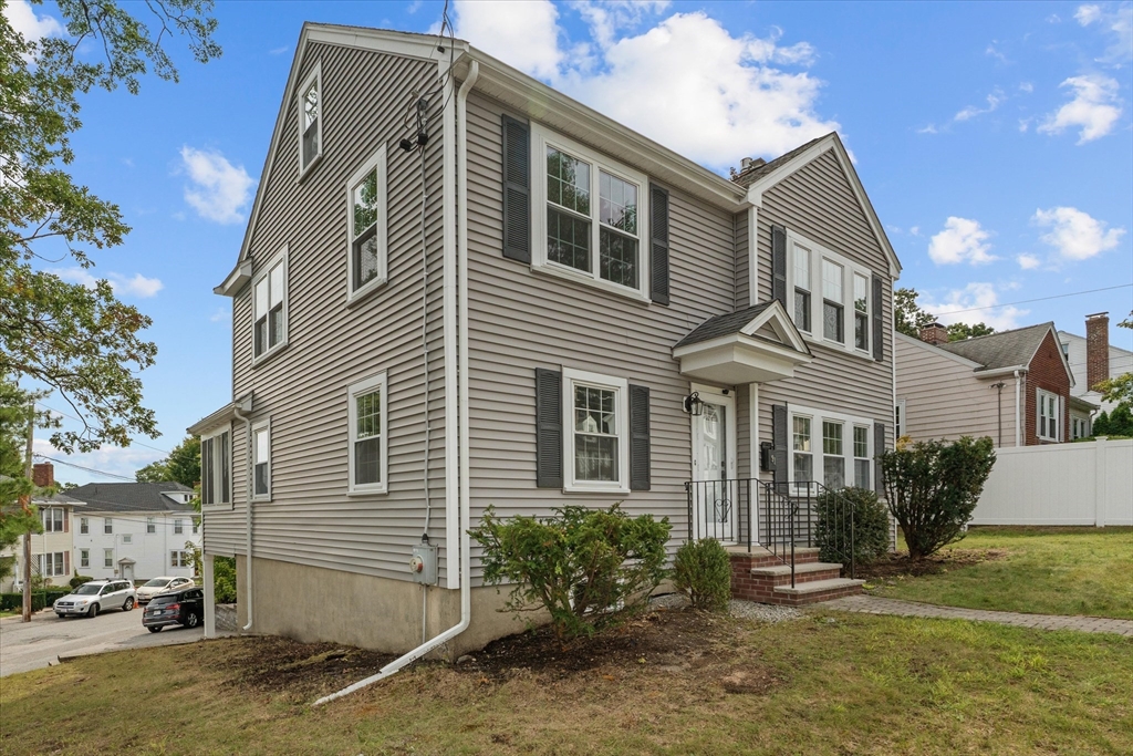 91 Prentice Street Waltham, MA 02451 - Photo 36 of 38 a front view of a house with garden