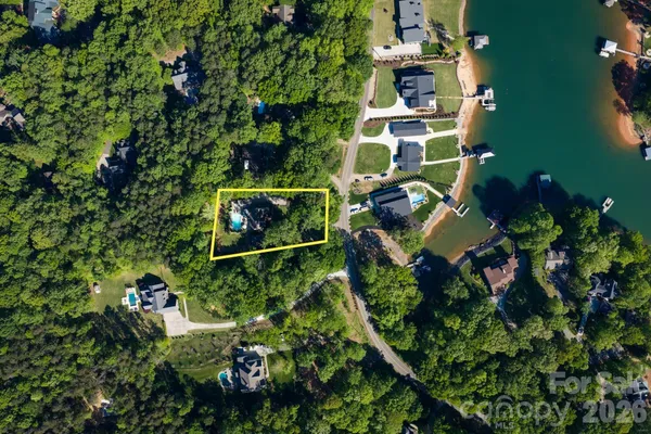 an aerial view of multiple houses with outdoor space