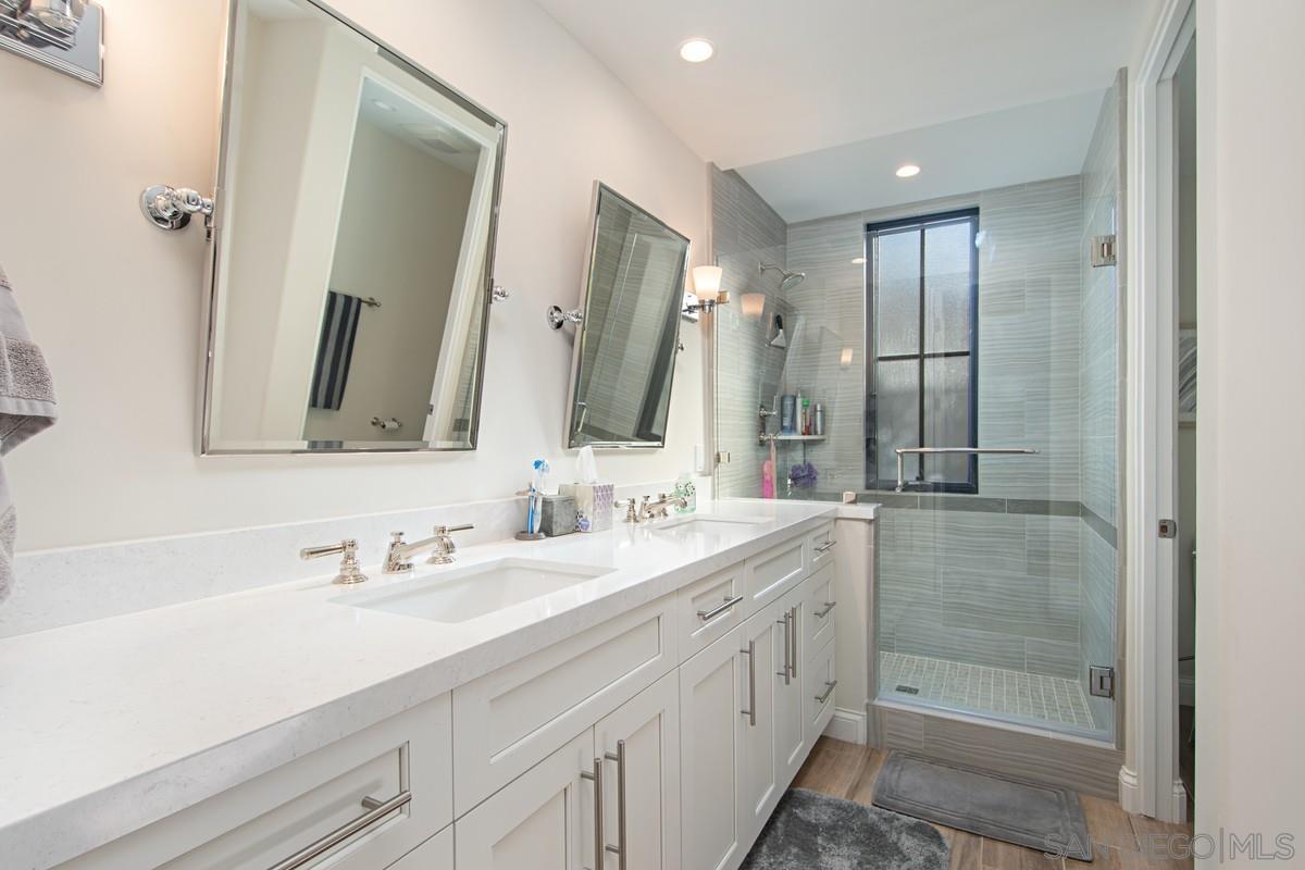 712 Silver Street La Jolla, CA 92037 - Photo 12 of 21 a bathroom with a double vanity sink mirror and double