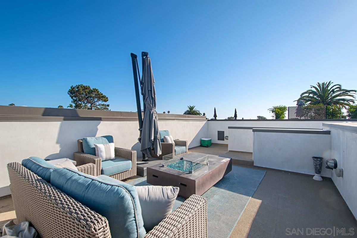 712 Silver Street La Jolla, CA 92037 - Photo 14 of 21 a living room with furniture and a potted plant