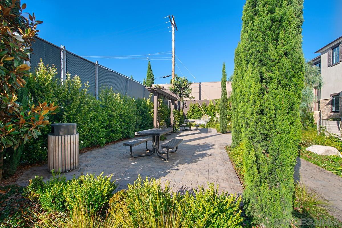 712 Silver Street La Jolla, CA 92037 - Photo 17 of 21 a view of a bench sitting in middle of flower