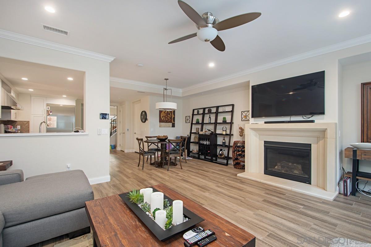 712 Silver Street La Jolla, CA 92037 - Photo 5 of 21 a living room with furniture a fireplace and a flat screen tv