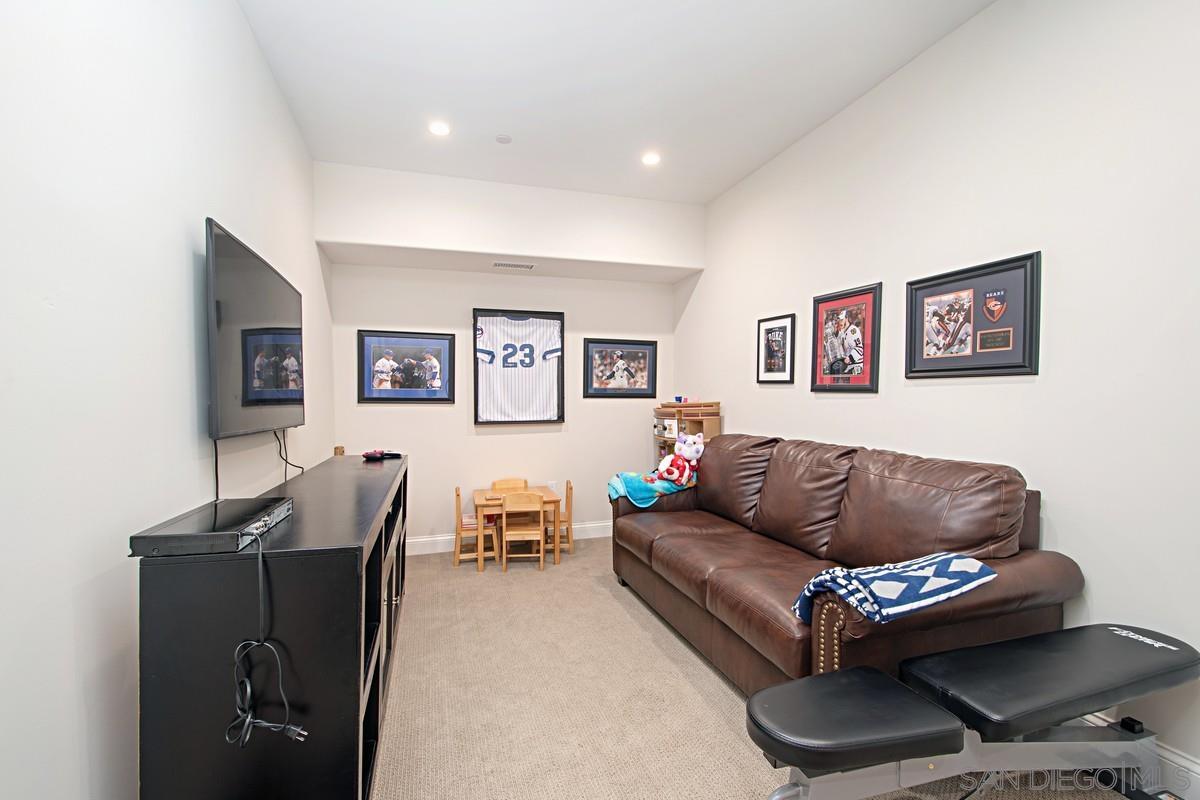 712 Silver Street La Jolla, CA 92037 - Photo 8 of 21 a living room with furniture and a wooden floor