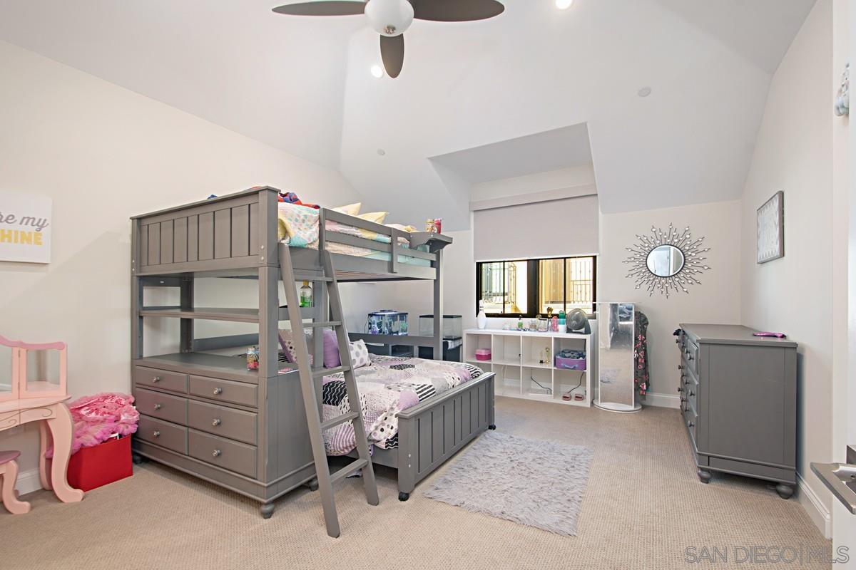 712 Silver Street La Jolla, CA 92037 - Photo 9 of 21 a bedroom with furniture and a large window