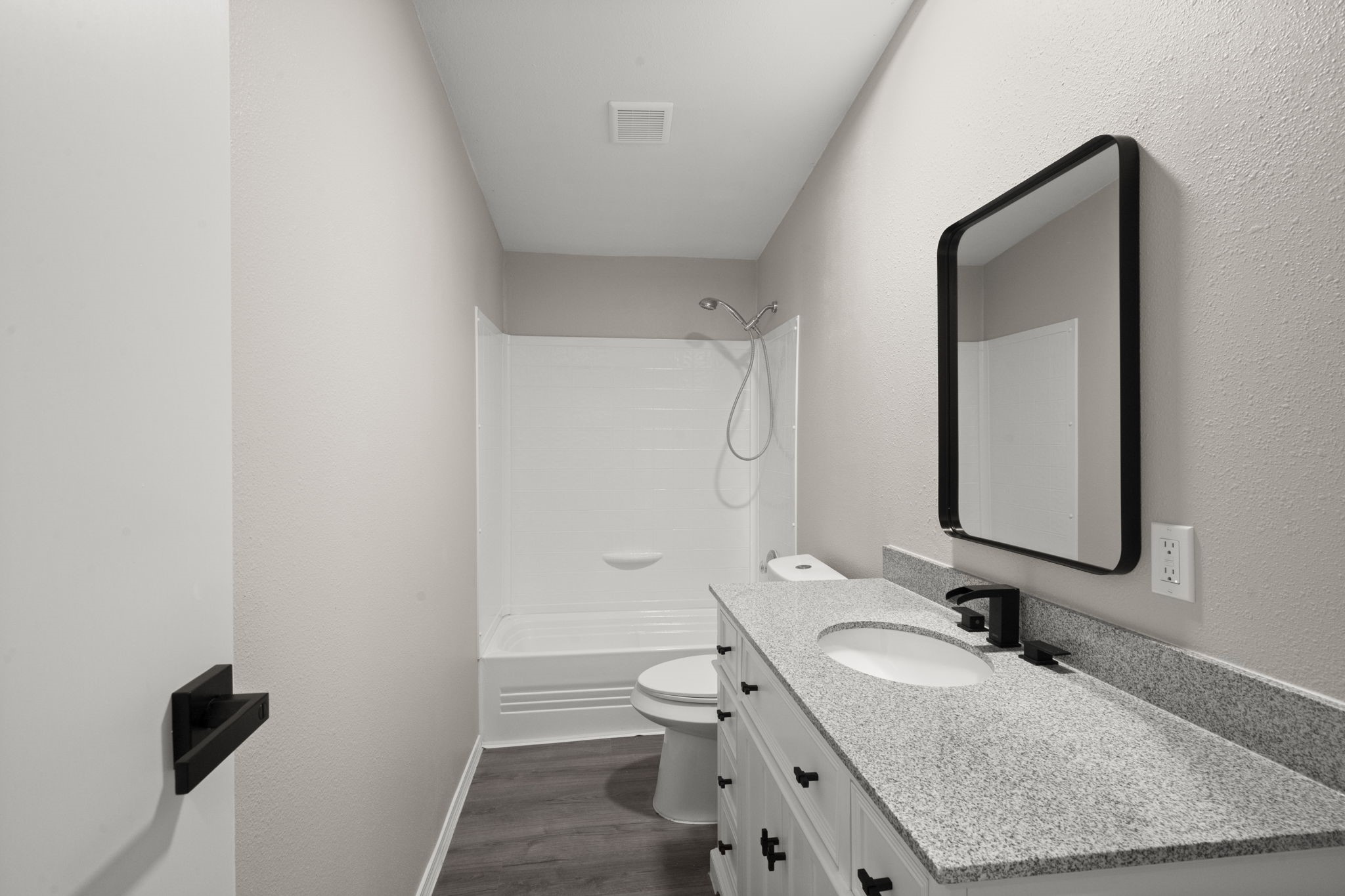 285 County Road 388 Cleveland, TX 77328 - Photo 14 of 23 a bathroom with a granite countertop sink toilet and mirror