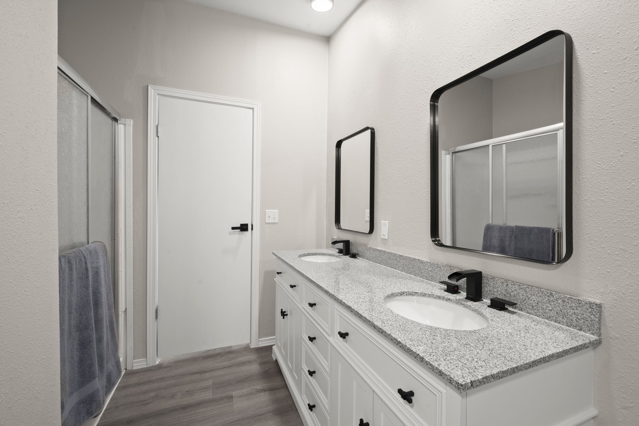 285 County Road 388 Cleveland, TX 77328 - Photo 17 of 23 a bathroom with a granite countertop sink and a mirror