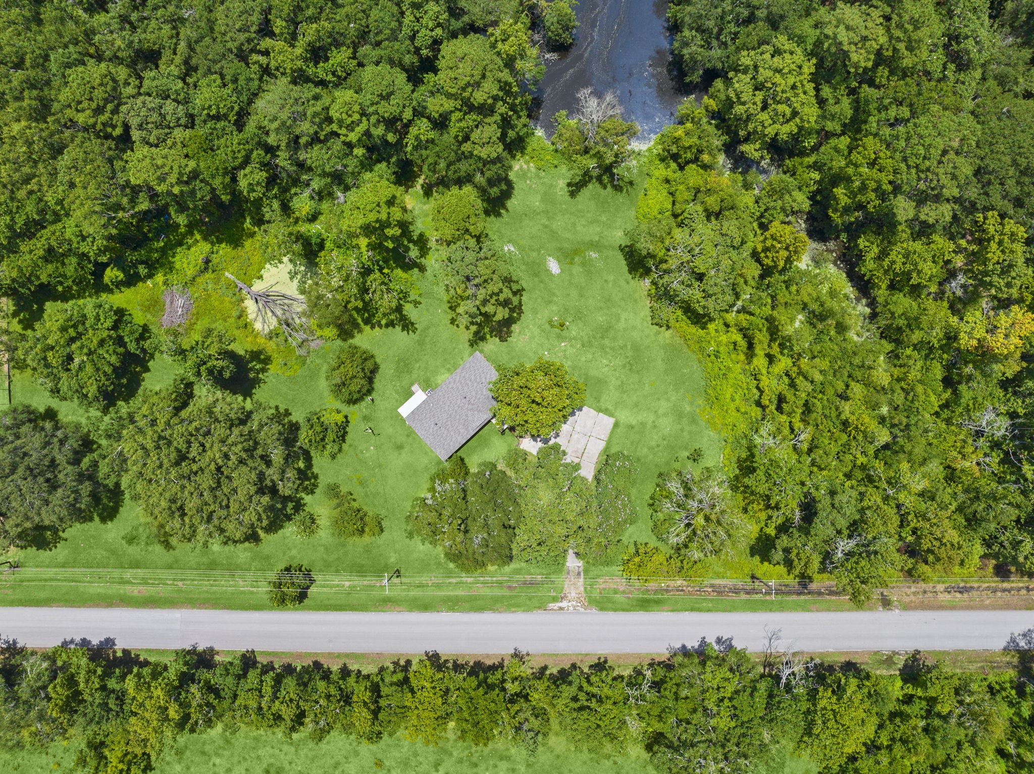 285 County Road 388 Cleveland, TX 77328 - Photo 23 of 23 a view of a lush green field