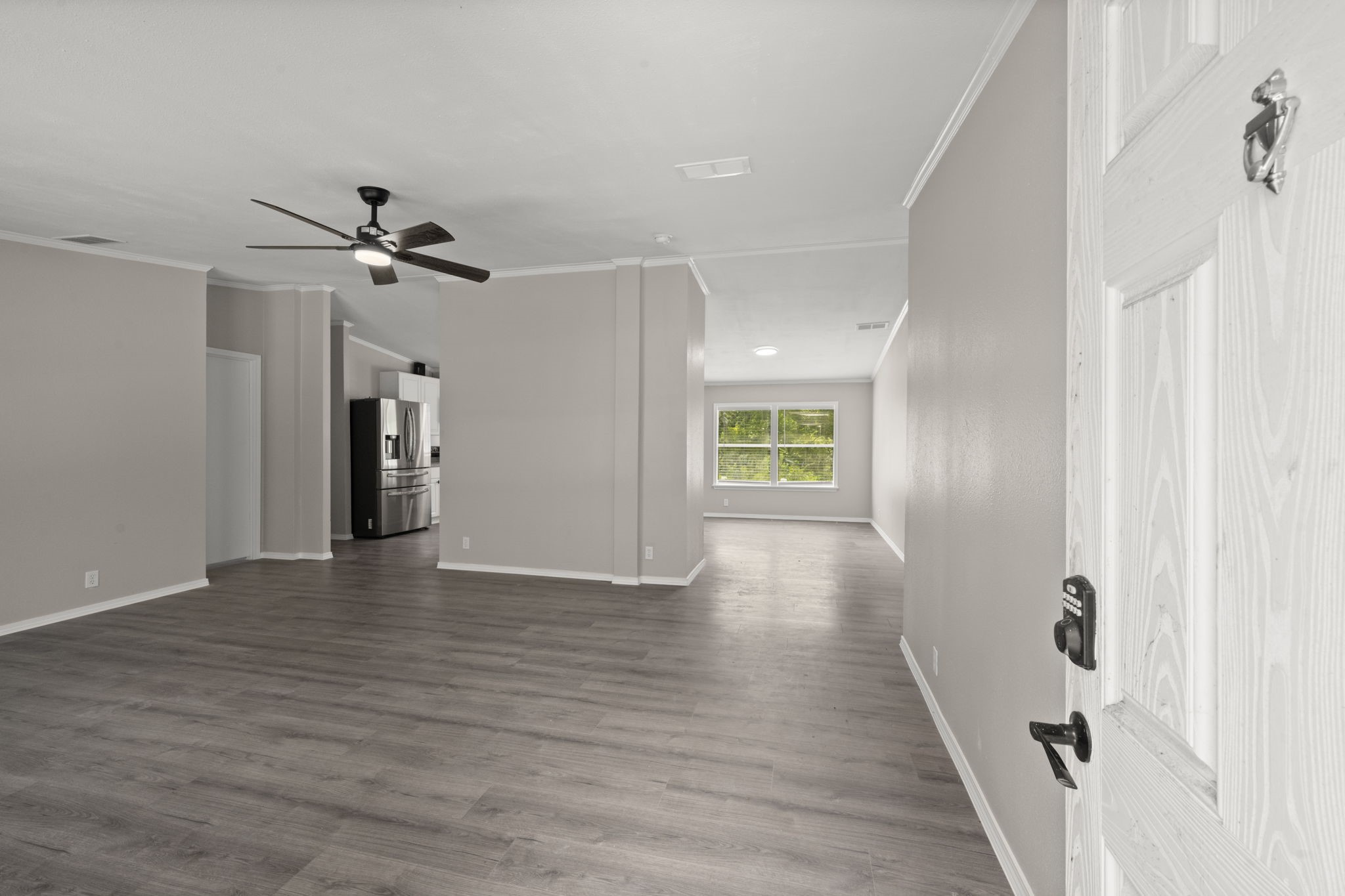 285 County Road 388 Cleveland, TX 77328 - Photo 5 of 23 wooden floor in an empty room with a window