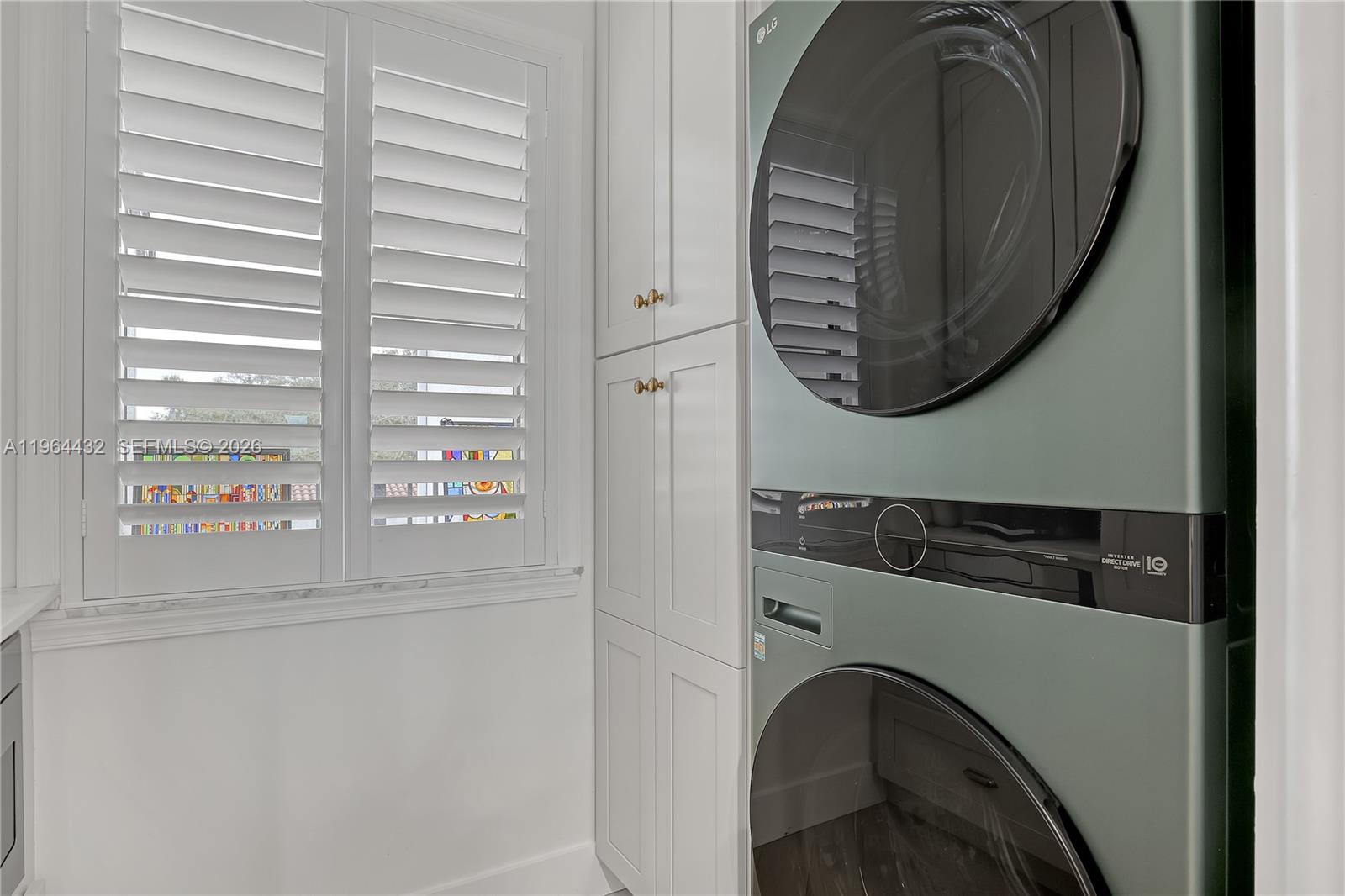 6062 Southeast Landing Way, Unit 10 Stuart, FL 34997 - Photo 12 of 37 a close view of washer and dryer