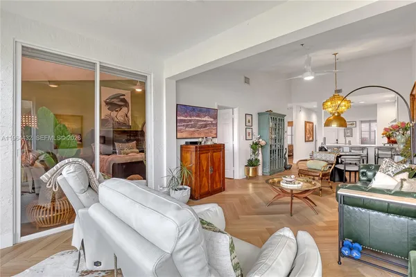a living room with furniture and a large window