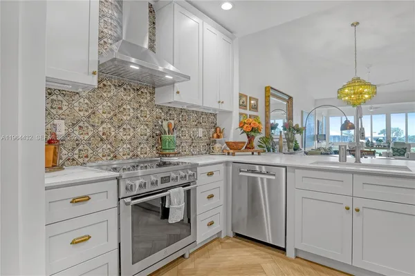 a kitchen with cabinets and window