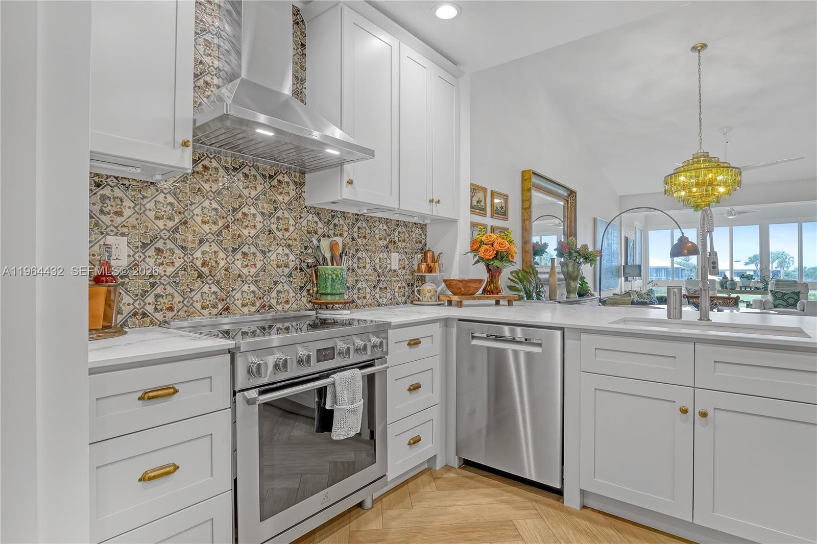 6062 Southeast Landing Way, Unit 10 Stuart, FL 34997 - Photo 7 of 37 a kitchen with cabinets and window