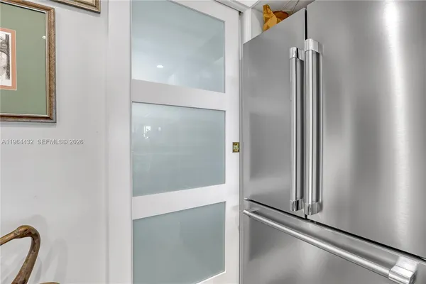 a bathroom with a shower and a glass door
