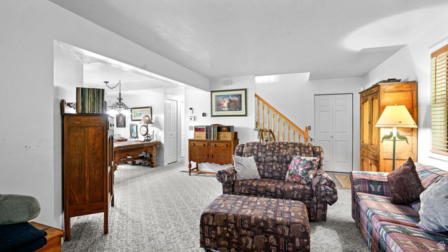 335 Jungfrau Hill Road Midway, UT 84049 - Photo 17 of 34 Carpeted living room with stairs