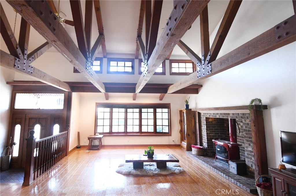 5621 Alwick Place Brea, CA 92821 - Photo 12 of 43 a living room with furniture fireplace and flat screen tv