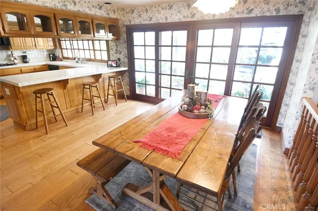 a dining room with a table and chairs